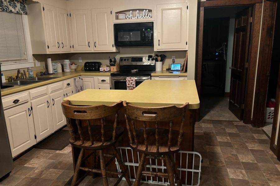 Finished kitchen remodel with updated cabinets, counters, and flooring