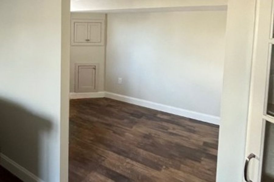 Finished basement remodel with updated walls, flooring, and trim